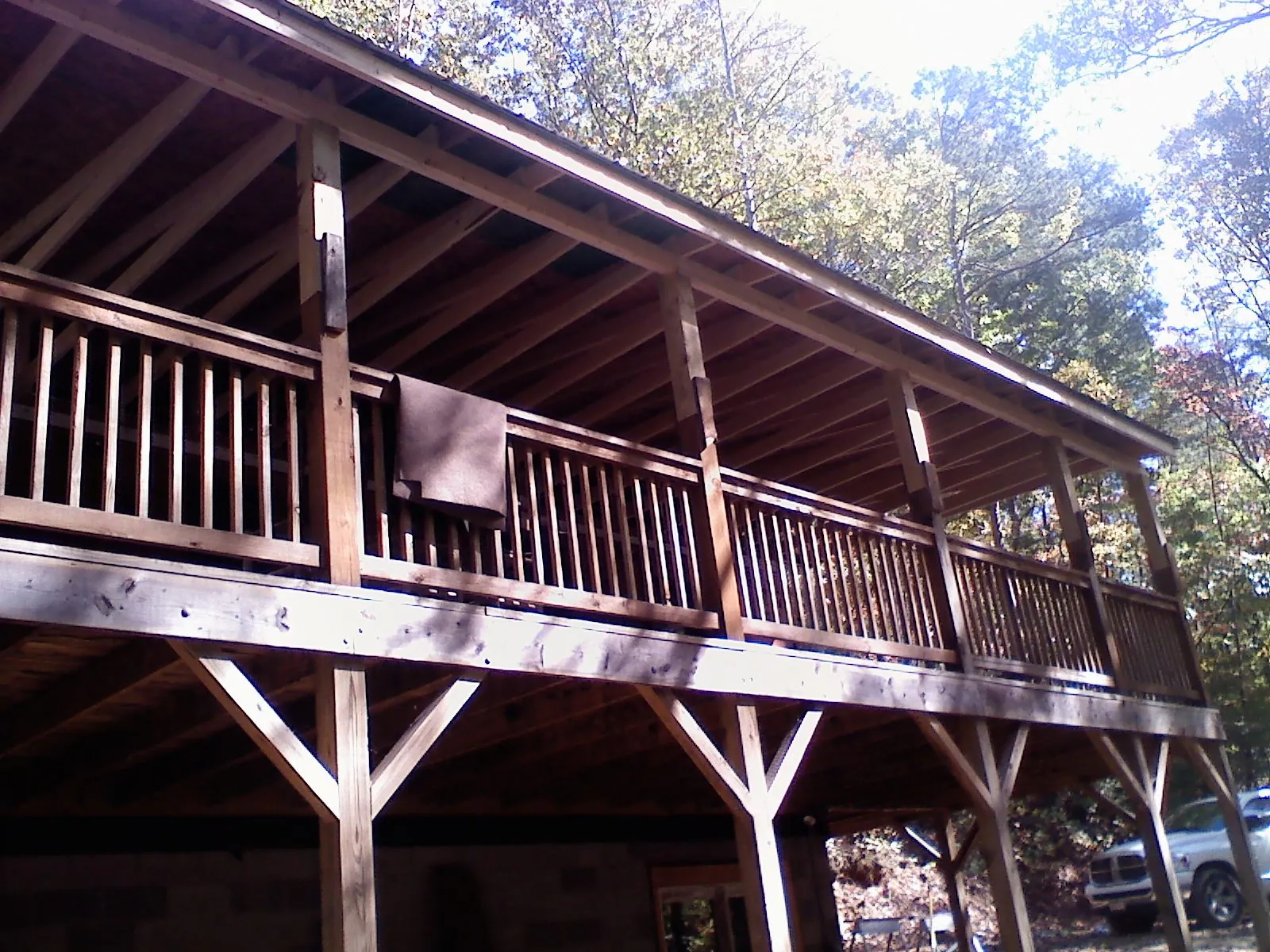 Timber framing under a new elevated porch and deck — Roof Leak Repair in River Rouge by Roofing Brothers